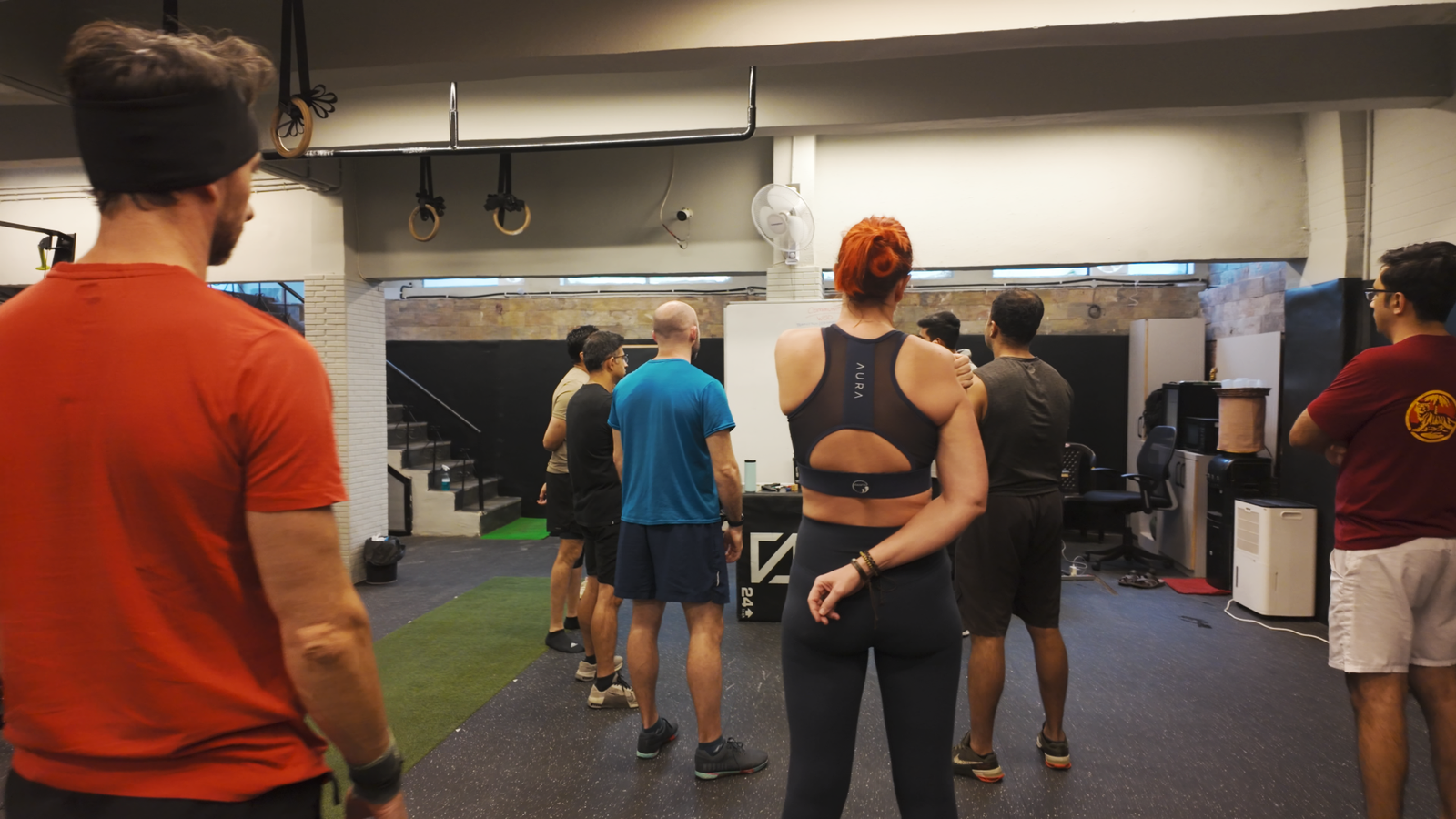 A member lifting under coach supervision at The Boxx